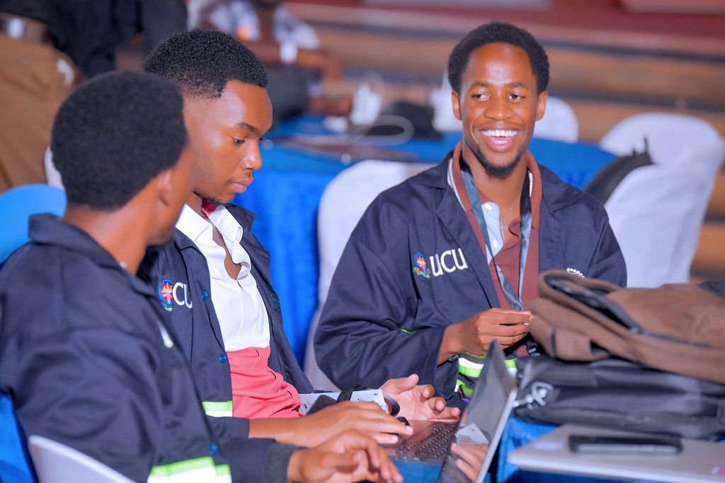 Students building together at AgentCon Mukono